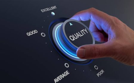 Selecting excellent quality to increase customer satisfaction. Quality assurance management and control for products or services. Concept with QA manager's hand turning knob.